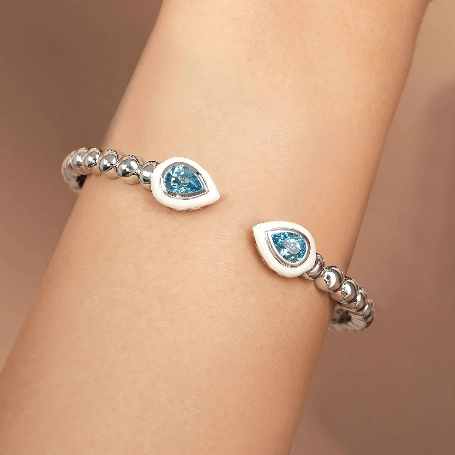 Bujukan Blue Topaz Open Bangle with White Enamel in Sterling Silver, photograph 4