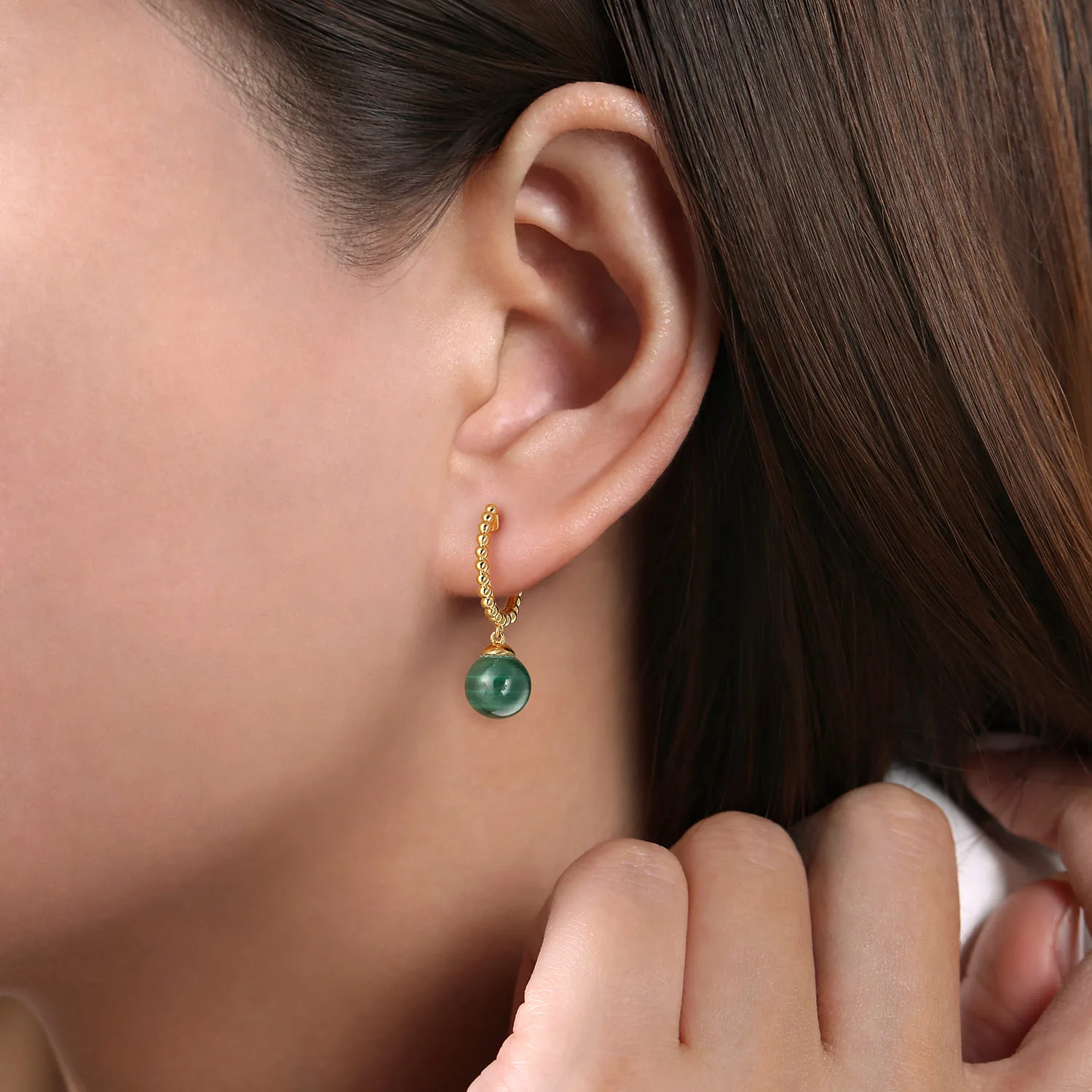 Bujukan Huggie Earrings with Malachite Drops in 14K Yellow Gold, photograph 2