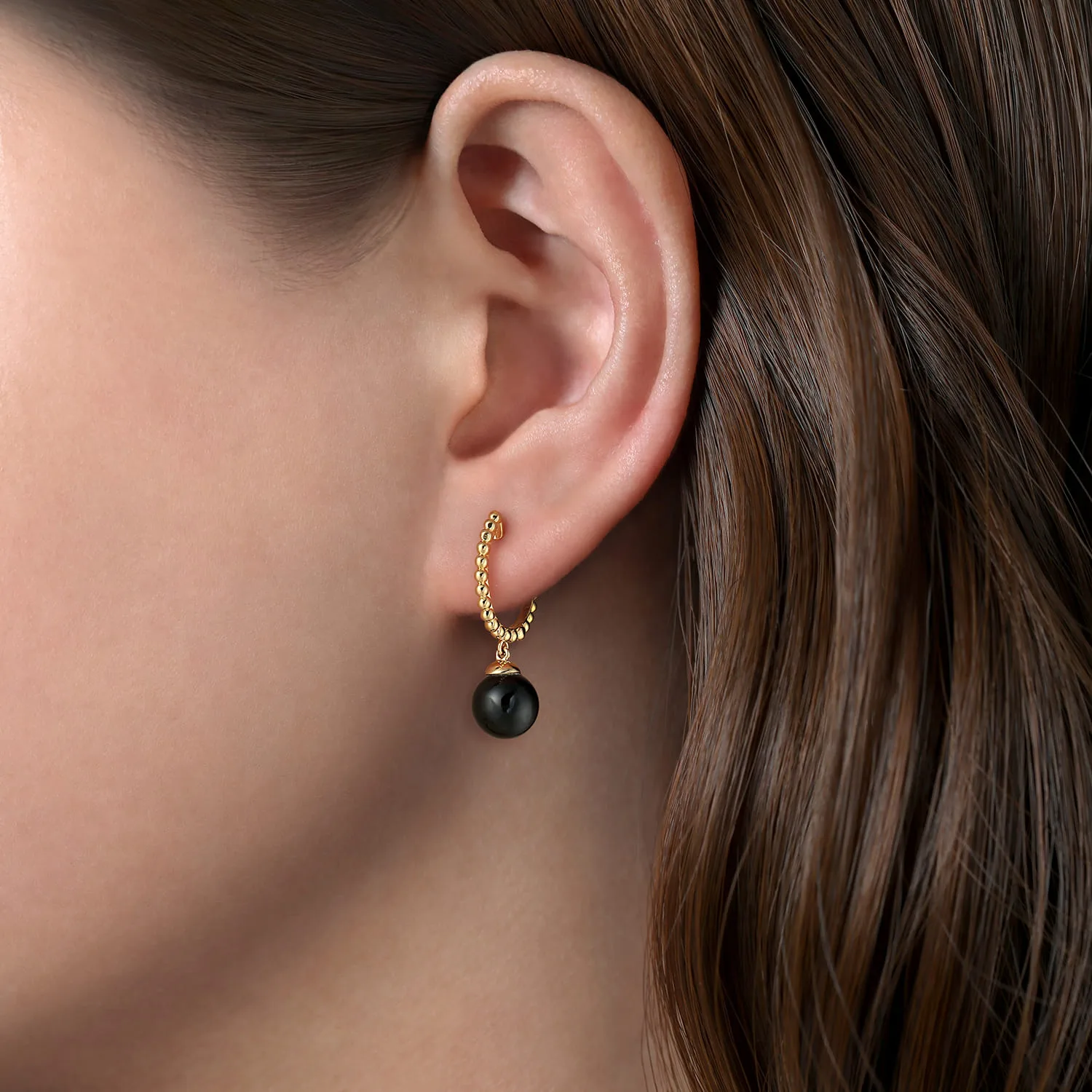 Bujukan Huggie Earrings with Onyx Drops in 14K Yellow Gold, photograph 2