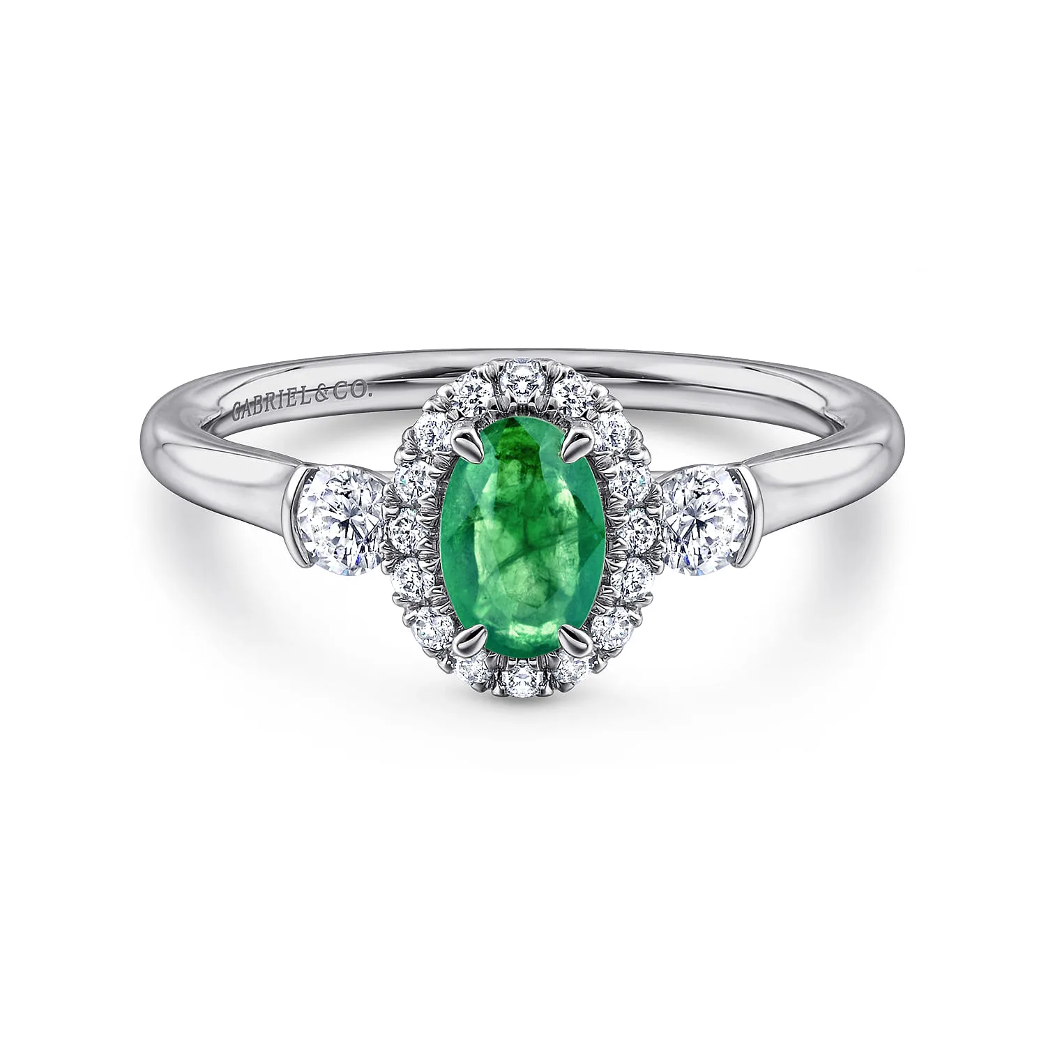 Oval Emerald and Diamond Halo Three Stone Ring