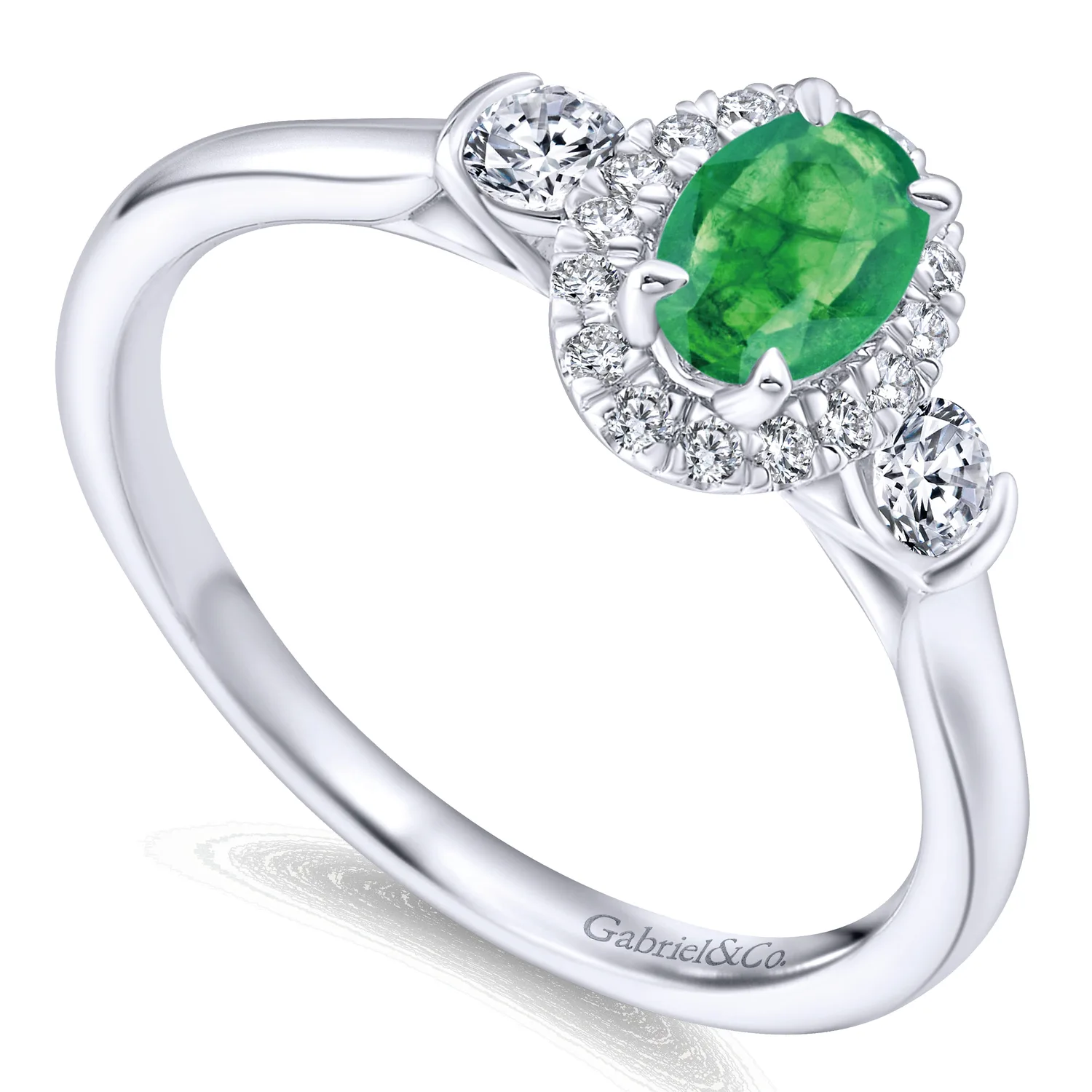 Oval Emerald and Diamond Halo Three Stone Ring in 14K White Gold, photograph 3