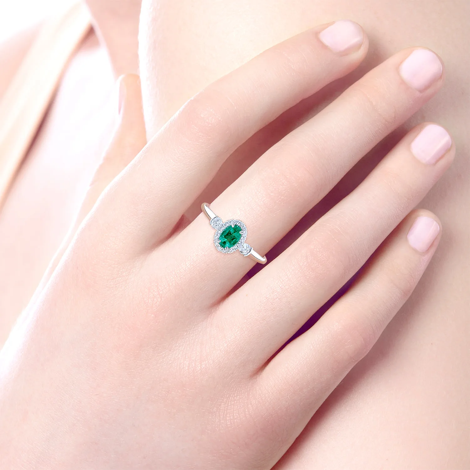 Oval Emerald and Diamond Halo Three Stone Ring in 14K White Gold, photograph 5