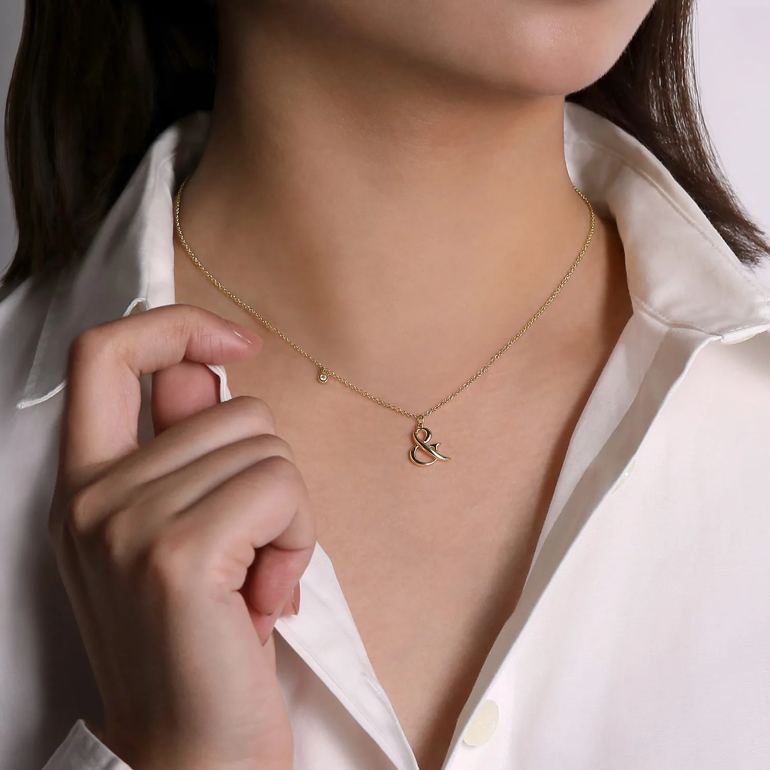 Ampersand Pendant Necklace with Bezel Set Diamond Drop in 14K Yellow Gold, photograph 4