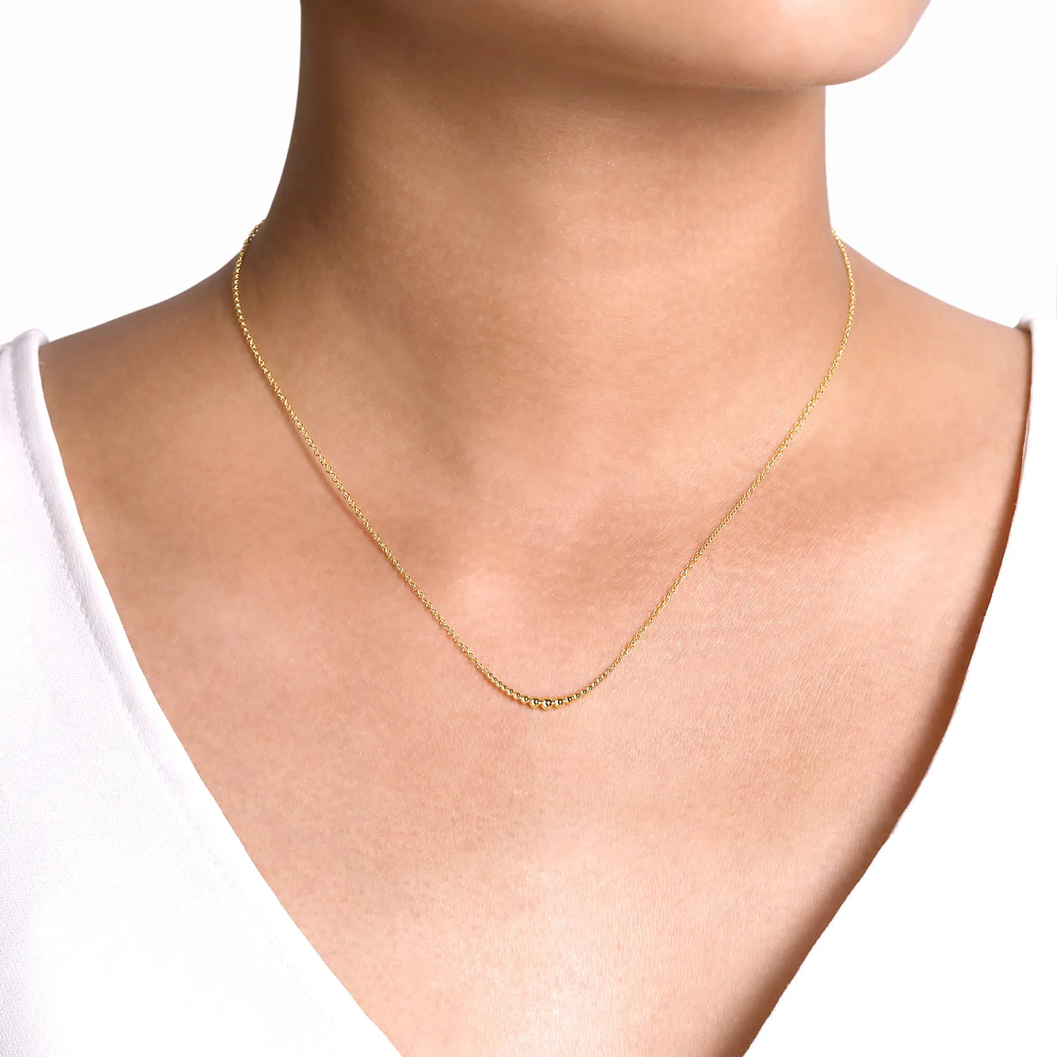 Graduating Bujukan Beads Curved Bar Necklace in 14K Yellow Gold, photograph 3