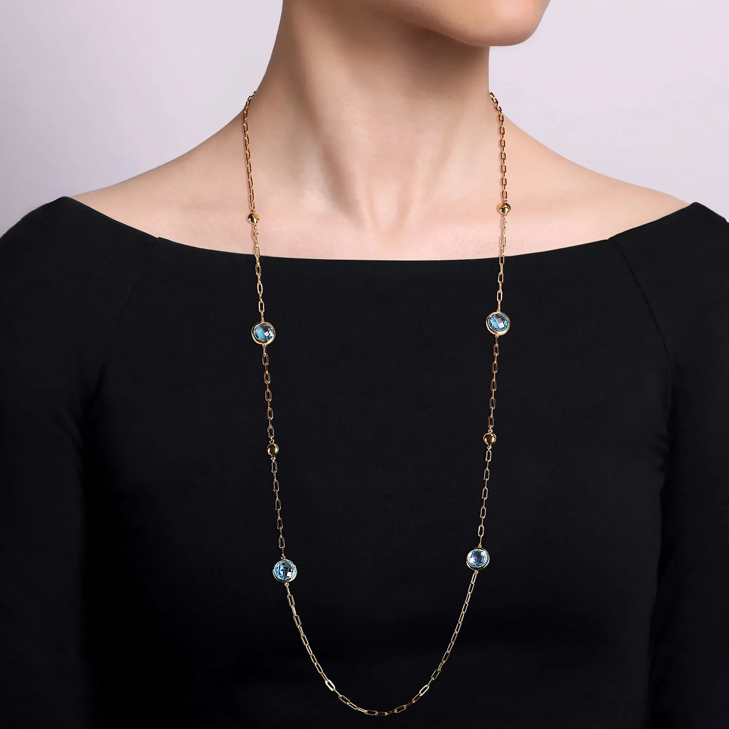 Blue Topaz Round Shape Necklace With Four Stations Beads and Bezel Setting in 14K Yellow Gold, photograph 3